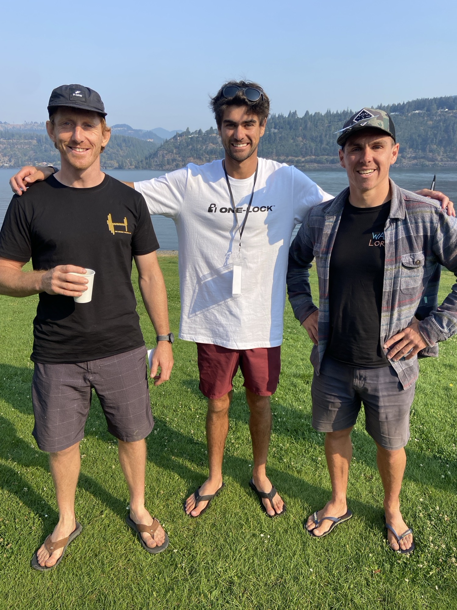 Three mates by the water, one in a GFP tee