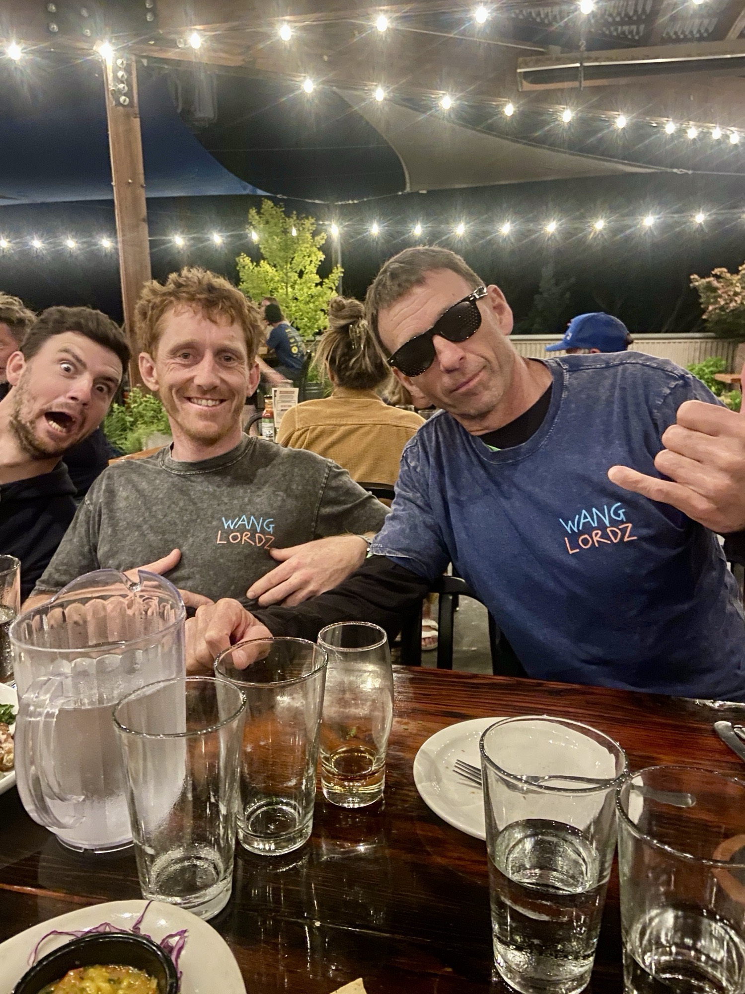 The crew at dinner, one in a Wang Lordz tee