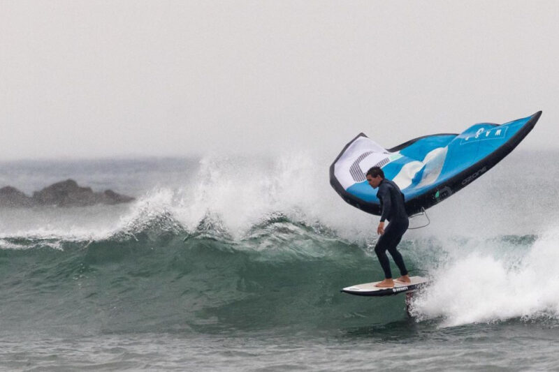 Freddie wing foiling on a wave